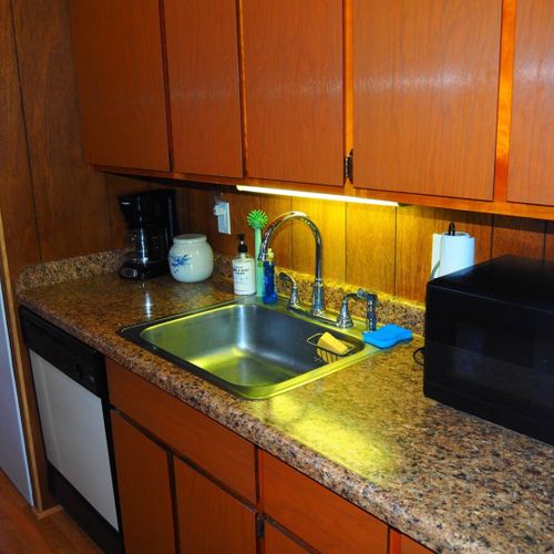Kitchen:  very convenient and functional galley kitchen with all appliances, including a dishwasher. Includes lots of counter space and a good supply of cooking and dining utensils.