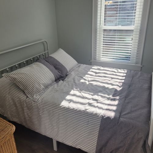 Bedroom #2:  features a full-size bed, dresser, mirror, and closet.
