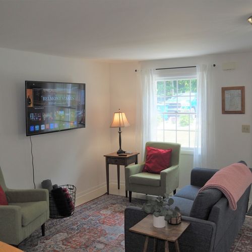 Living room:  very comfy living room with a large television with live streaming.