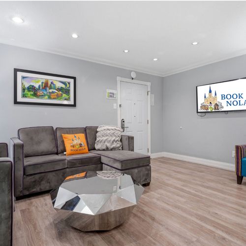 Lounge in style in this modern living space w/ cozy seating & warm accents.
