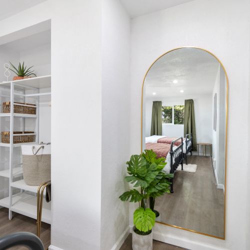 As soon as you walk into this room you'll be staring back at your reflection in the floor-to-ceiling, gold mirror! Perfect for helping your group to get ready or a quick selfie! The room consists of 2 queen size beds and plenty of room for your luggage!