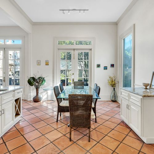 Bright dining area with garden views and stylish decor.