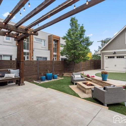 A spacious deck area extends seamlessly into the backyard, providing an ideal spot for outdoor relaxation.