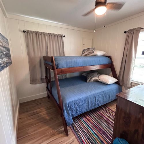 Bedroom #2:  features a twin-on-full bunk bed, ceiling fan, and dresser.