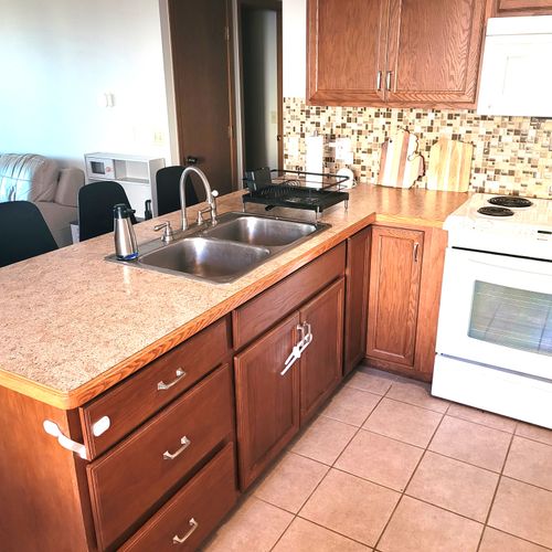 KITCHEN:  The home has a cute and modern kitchen with all appliances, except for a microwave and a dishwasher.