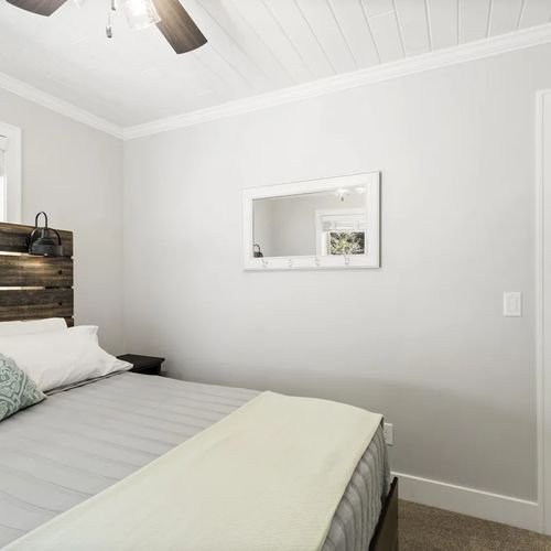 BEDROOM #3 (UPPER LEVEL):  Very cute upper level bedroom with a queen-size bed, nightstands, ceiling fan, mirror, and closet.