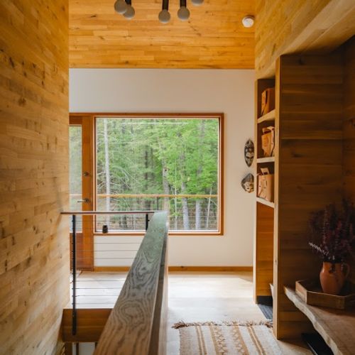 Warm wood tones throughout the entryway