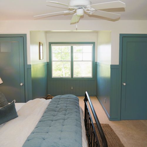 Bedroom #2 (second floor):  features a king-size bed, closets, chair, ceiling fan, and great views of the backyard, long lake, and sleeping bear dunes.