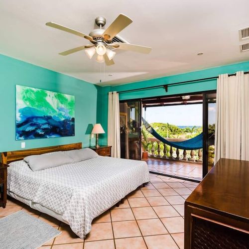 Mater bedroom with a king bed
