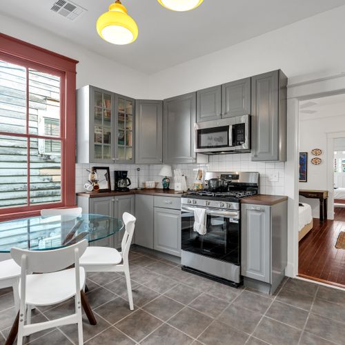 Fully equipped kitchen w/ stainless appliances & generous counter space for home-cooked meals.