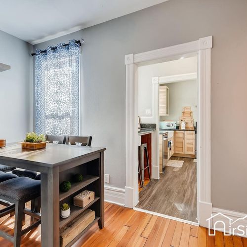 - compact dining space with a tall table and storage shelves, perfect for quick bites or work
- natural light streams in from the window, giving the nook a fresh and airy vibe
- direct access to the kitchen makes mealtime easy and social