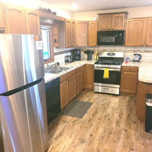 KITCHEN:  The home has a large and modern kitchen with all appliances including a dishwasher.  A good supply of cooking and dining utensils is also included.