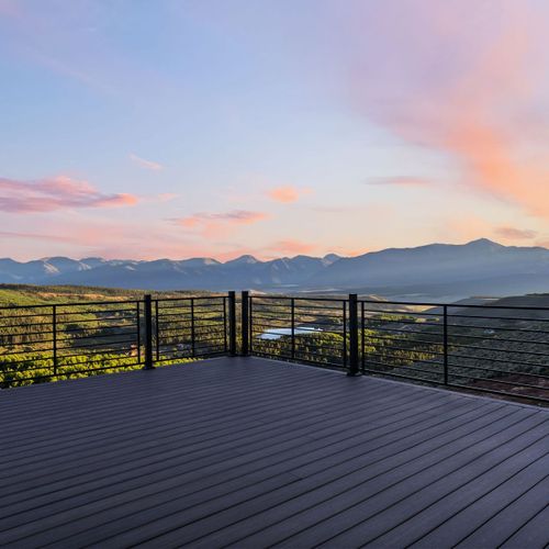 Expansive deck seamlessly connects from living area to breath-taking views.