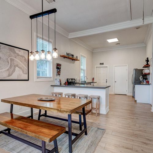 Open, light-filled space w/ modern pendants — bright & airy from every angle.