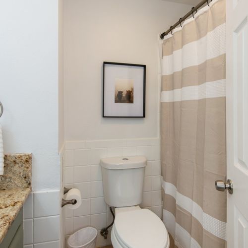 The home features 3 well-appointed bathrooms, each equipped with bright lighting, large mirrors and hotel-grade towels.