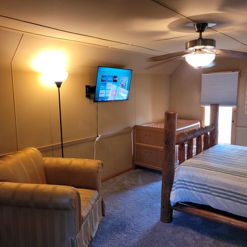 BEDROOM #3 (SECOND FLOOR):  Features a queen-size bed, comfy chair, sofa bed, baby crib, ceiling fan, dresser, and private live-streaming television.