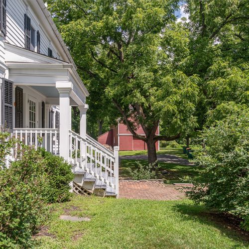 Views of the sweeping property, from the front porch to the barn beyond.
