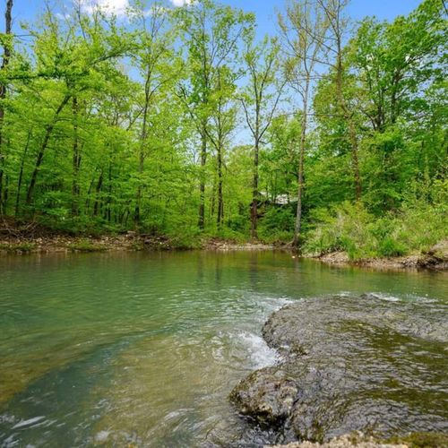 Flowing creek just steps away from the property! Bring your fishing poles!