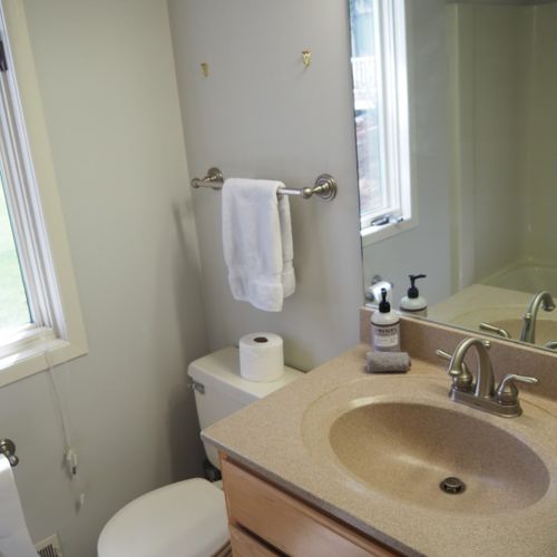 Guest bathroom:  this is a full bathroom that has a common entrance. It includes a combination tub and shower.