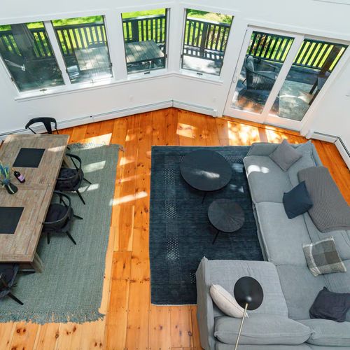 Combined living and dining area with access to the deck