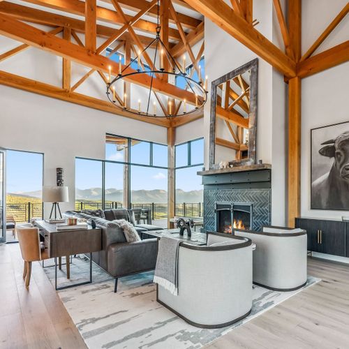 Elegant living area featuring gas fireplace and modern mountain décor.