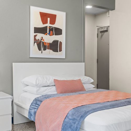 Settle into a peaceful night's sleep in this tranquil bedroom. The soft lighting and comfortable bedding are perfect for unwinding and recharging.