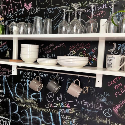 Fun chalkboard wall in the kitchen — leave a message or a little drawing.