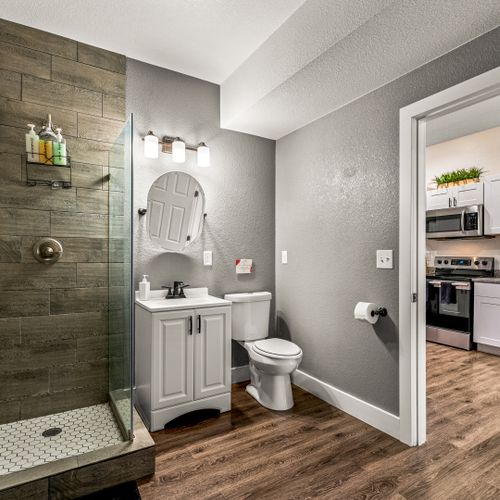 Spa-inspired walk-in showers and calming details make this bathroom a daily upgrade.