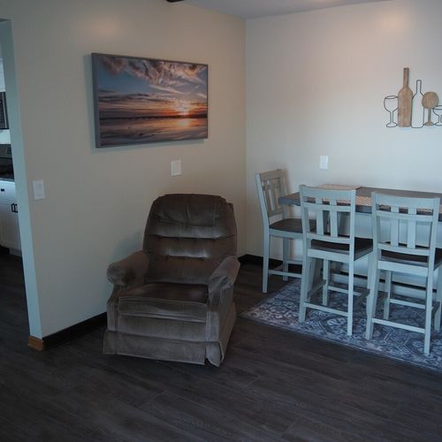 Dining area:  in-between the kitchen and the living room is a small dining area and cozy chair that's in front of the television.