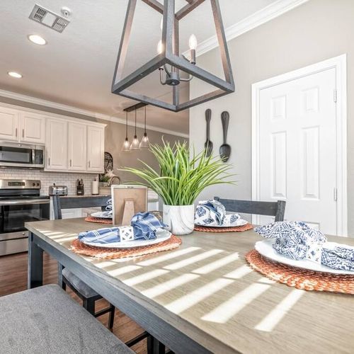 The dining area flows to Kitchen