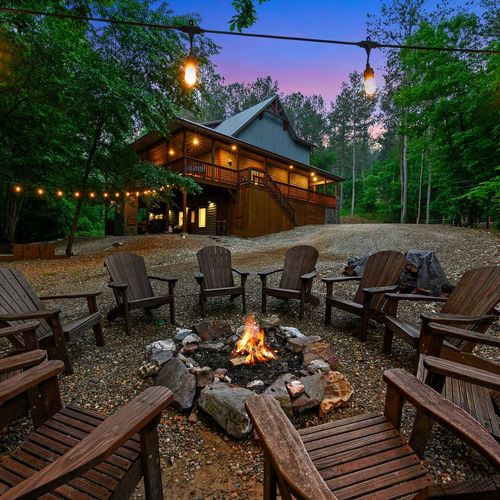 A fire pit with Adirondack chairs sits out back.