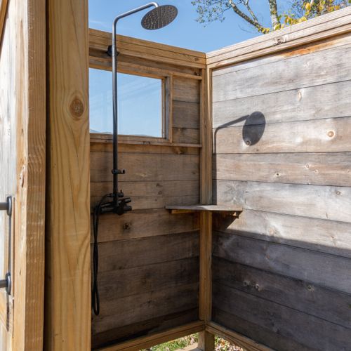 Peering into the outdoor shower.