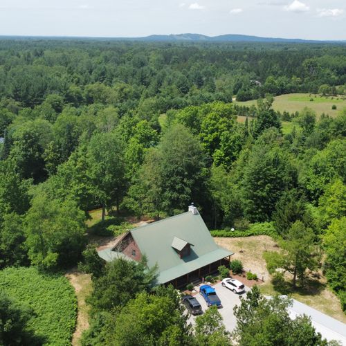 Exterior:  a summertime aerial view of the property with crystal mountain in the background.