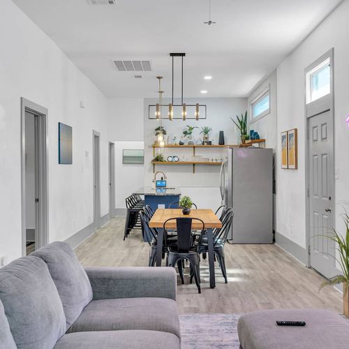Open-concept dining area w/ modern pendant lighting — perfect for gathering around a meal.
