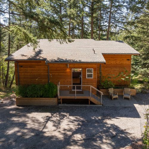 With parking to each side and a small patio for sitting, the entry of the house is tidy and welcoming.