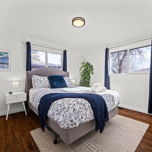 The sunlit and airy master bedroom includes an en suite bathroom for your convenience.