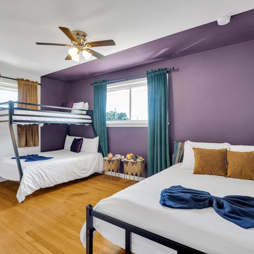 Spacious and fun, this colorful room sleeps up to five guests—ideal for families or groups looking to relax and recharge in style!