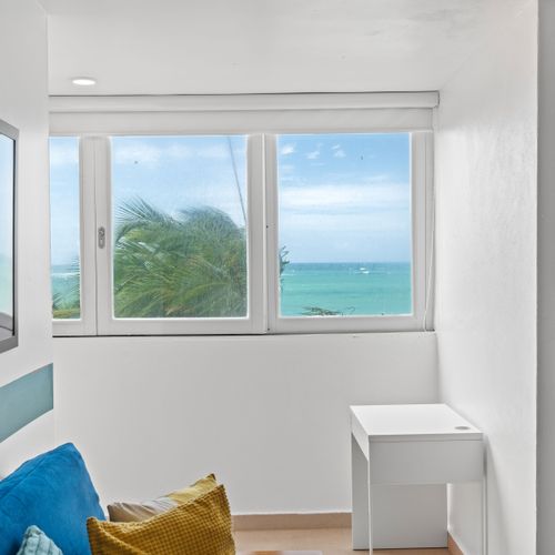 Experience serenity and entertainment in one space. Relax on the cozy couch or engage in some retro gaming, all while soaking in the stunning ocean views just outside your window.