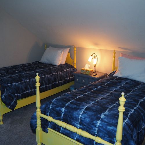 Bedroom #3 (second floor):   features 2 twin beds, private television, comfy chair, and a closet.