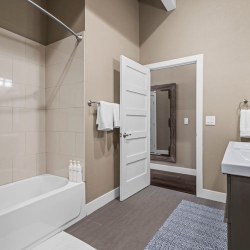 Enjoy a roomy bath complete with a dual vanity and convenient tub–shower combo.