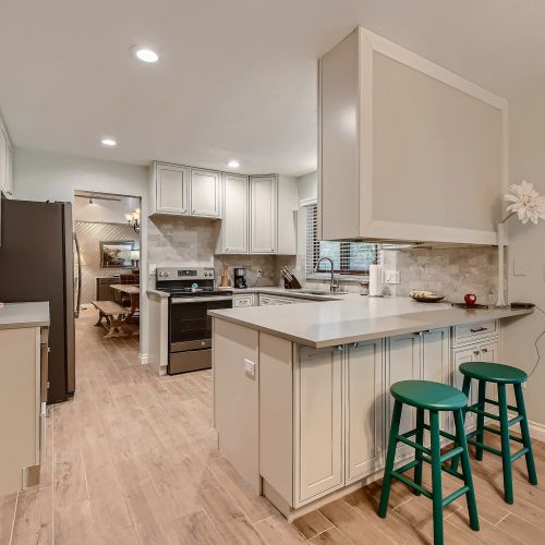With bar stools and a kitchen table with much seating, this kitchen also provides an inviting space for hanging out with your loved ones.