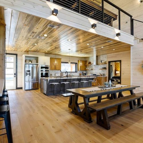 The formal dining table and bar top seating