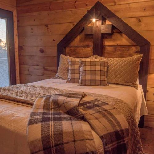 This bedroom (room 3/4 upstairs) holds a Queen bed as well as an exit to outside.