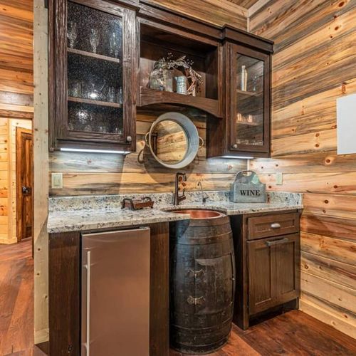 A whiskey barrel wet bar in the game room.
