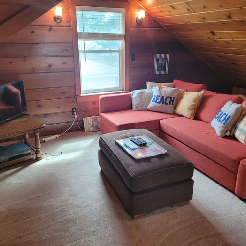 Bedroom #4 (larger hosue, second floor):  this is a large private area with its own sectional sofa, television, desk, and two twin beds.