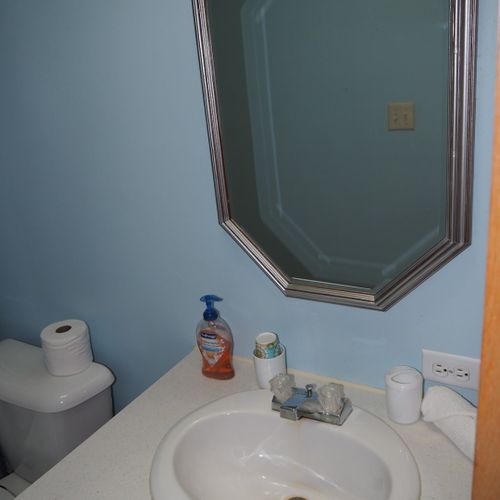 Bathroom #2:  the sink, mirror, vanity, and toilet