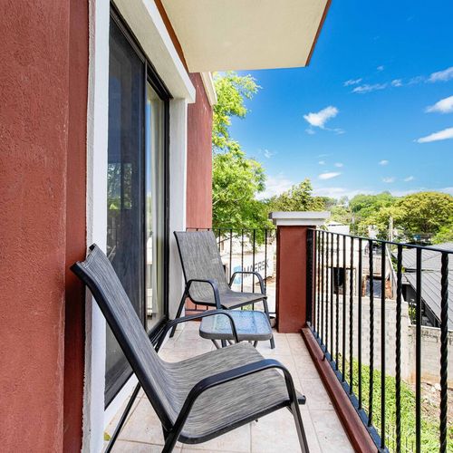 Small balcony looking at the pool and gardens.