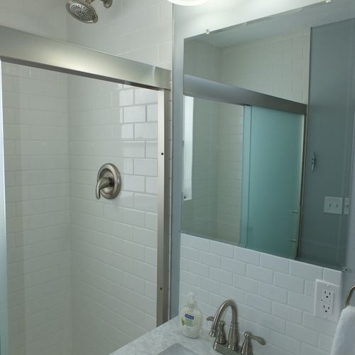 Bathroom (downstairs):  another view of the bathroom with the sliding shower door opened.