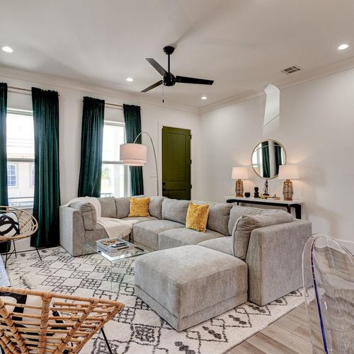 Stylish living room w/ plush sofa & seating for everyone — comfort meets character.