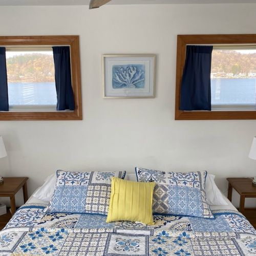 Bedroom #3 (second floor):  features a king-size bed, dresser, closet, ceiling fan, and great views of betsie lake!